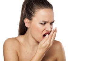 woman needing bad breath treatment