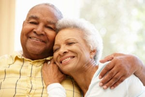 older African American couple smiling and enjoying life