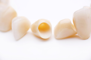 dental crowns on plain white surface