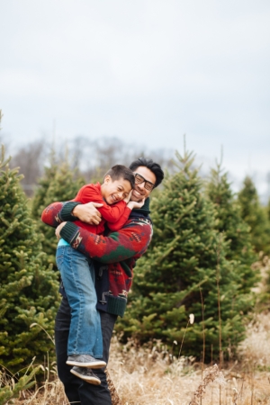 father and son hugging in Denver Tree farm