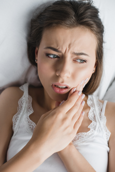 woman with dental pain may need tooth extraction