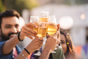 four friends cheersing with champagne glasses